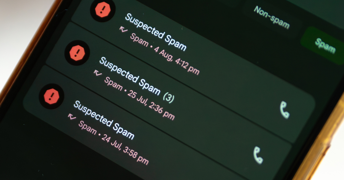 Close-up of a smartphone call log with several suspected spam calls flagged.